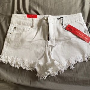 White shorts size 9/29, with fringe on bottom!